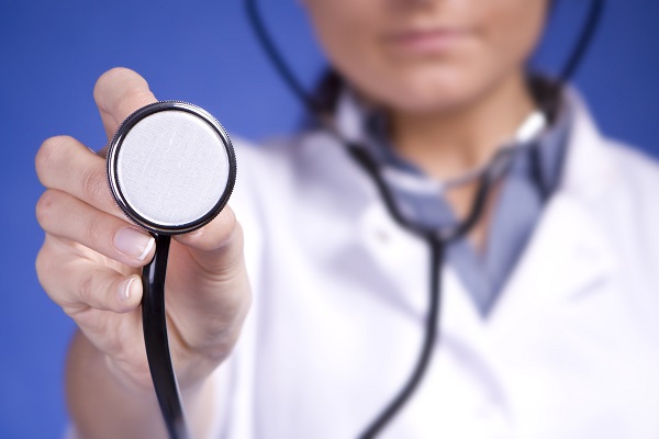 Doctor holding stethoscope to camera