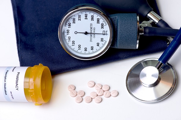 Blood pressure cuff and pills