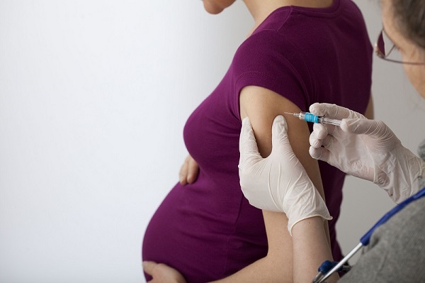Pregnant woman being vaccinated